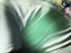 A hip tanned brunette in a hat has her ass filmed in an upskirt porno