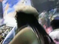 A hip tanned brunette in a hat has her ass filmed in an upskirt porno