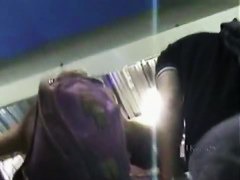 A hip tanned brunette in a hat has her ass filmed in an upskirt porno