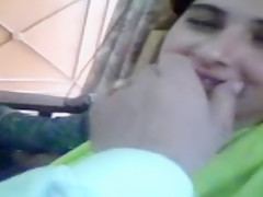 Adorable Pakistani wife kisses her fashionable spouse