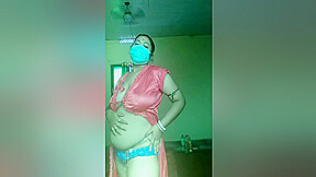 An Indian Woman In A Red Gown Showing Off Her Body And Playing With Her Boobs