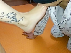 Asian amateur MILF gives her slave a hot footjob with her oily mature feet