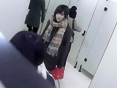 Asian girl gets filmed in a public toilet