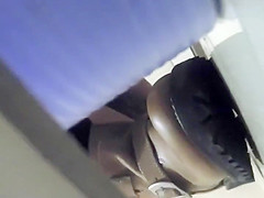 Asian girl gets filmed in a public toilet
