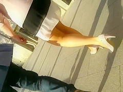 Attractive blonde lady jiggles her butt as she walks