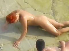 Beach couple sex play