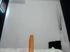 Beautiful girl rides a huge dildo and dances naked