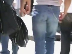 Beautiful street candid is being video taped by a guy
