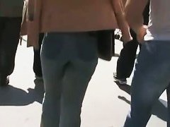 Beautiful street candid is being video taped by a guy