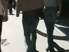 Beautiful street candid is being video taped by a guy