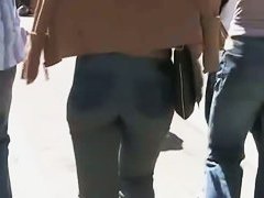 Beautiful street candid is being video taped by a guy