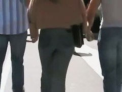 Beautiful street candid is being video taped by a guy