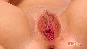 Belle Fatale uses a large purple dildo to get her gaping pussy wet
