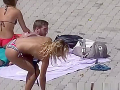 Blonde teen 18+ sunbathing by the pool