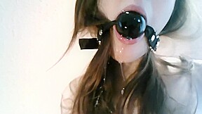 Bound girl with ball gag gets messy
