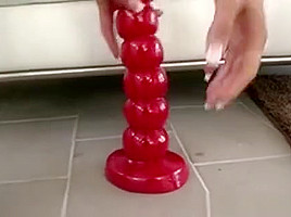 Brunette Sits On Giant Dong