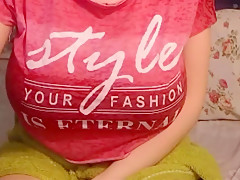 Busty sexy with glasses penetrates her wet pussy with a dildo in her bedroom