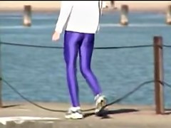 Candid amateur in lilac pantyhose walking along the quay 03zm