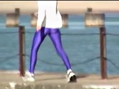 Candid amateur in lilac pantyhose walking along the quay 03zm