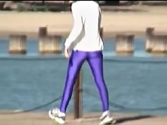 Candid amateur in lilac pantyhose walking along the quay 03zm