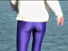 Candid amateur in lilac pantyhose walking along the quay 03zm