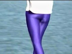 Candid amateur in lilac pantyhose walking along the quay 03zm