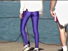 Candid amateur in lilac pantyhose walking along the quay 03zm