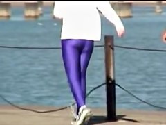 Candid amateur in lilac pantyhose walking along the quay 03zm