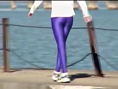 Candid amateur in lilac pantyhose walking along the quay 03zm