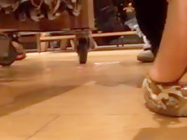Candid woman with meaty feet in mules