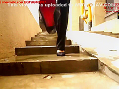 Chinese Mistress Tramples Her Slave All Over His Body And Neck