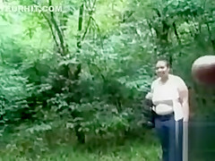 Chubby woman is mesmerized by his large cock in public