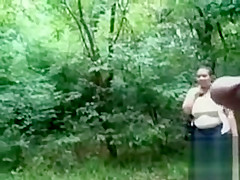 Chubby woman is mesmerized by his large cock in public