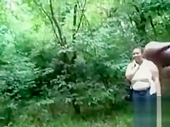 Chubby woman is mesmerized by his large cock in public