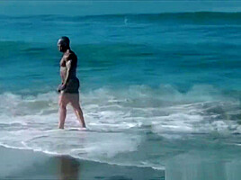 Con! The Red Devil on the beach!