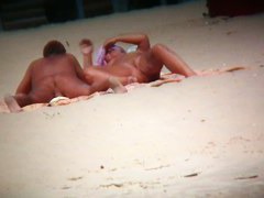 Couple exposing for the at the beach