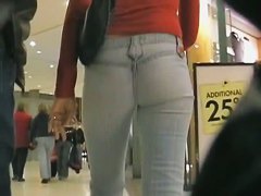 Cute brunette walking her ass in tight jeans on candid cam