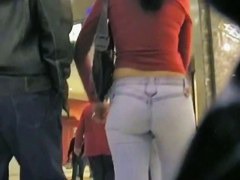 Cute brunette walking her ass in tight jeans on candid cam