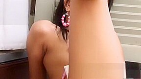 Daniel Lyn reveals her tiny boobs and her narrow pussy for the camera