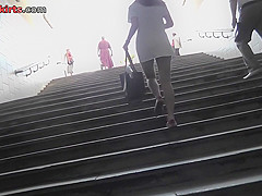 Dark-haired babe caught on the upskirt camera