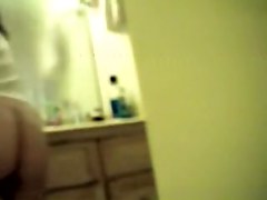 Doll waving her soft booty on hidden shower camera