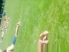 Exotic girl in small bikini at park