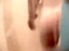 Fem butt and crotch reflected in the shower mirror spied