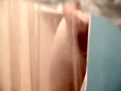 Fem butt and crotch reflected in the shower mirror spied
