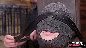 Gagged submissive clamped and caned while bound by master