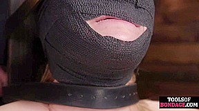 Gagged submissive clamped and caned while bound by master