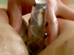 Gay prepares a clients ass with a dildo