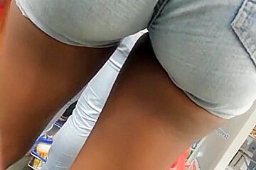 Girl in tight jeans shorts