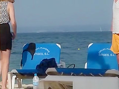 Girl on the beach dresses pants