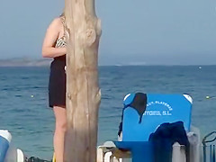 Girl on the beach dresses pants